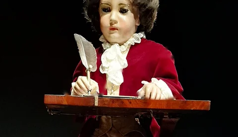 The Jaquet-Droz Writer automaton with its writing surface, quill, and hands in view